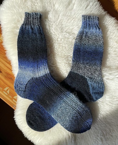 Debbie (@love.knit.spin.weave) finished a pair of socks for her husband using Schoppel Wolle Zauberball Crazy in colour 2089.