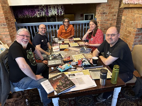 The second City of Mist crew, five players around the table with a map of 'The City' and a plethora of dice and character folios.