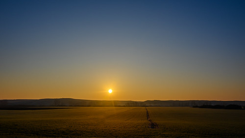 Meeting the sun near the road by Milen Mladenov, I was traveling to my village when I saw the first sun rays for the day and although there weren't a