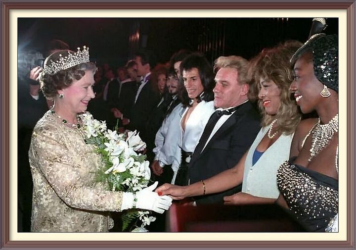 The late Queen Elizabeth II meeting Tina Turner, watched by the comedian Freddie Starr, following a Royal Variety Performance at the London Palladium in 1989