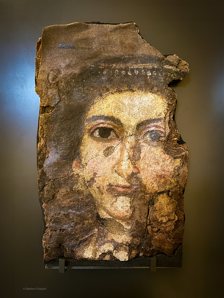 Fragment of a painted mummy shroud, showing a woman's face (Fayum, Egypt)
