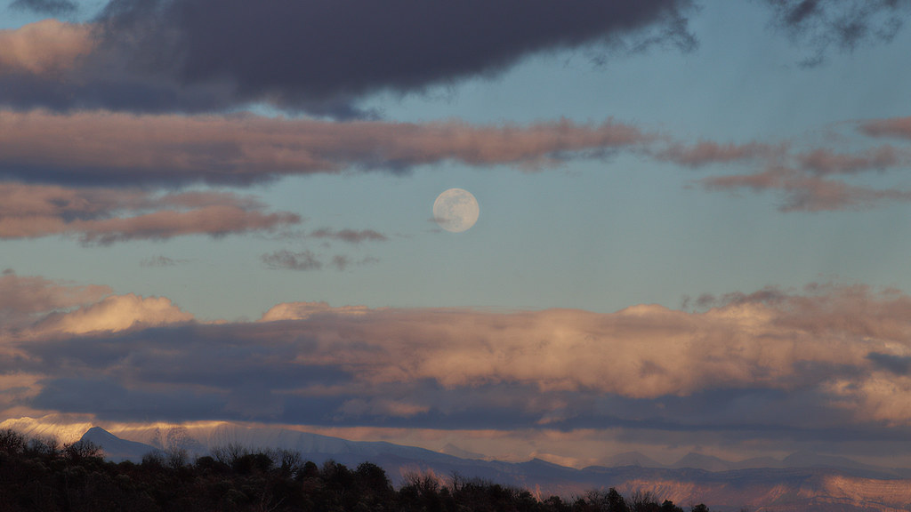 Moonrise, sunset and a break in the clouds