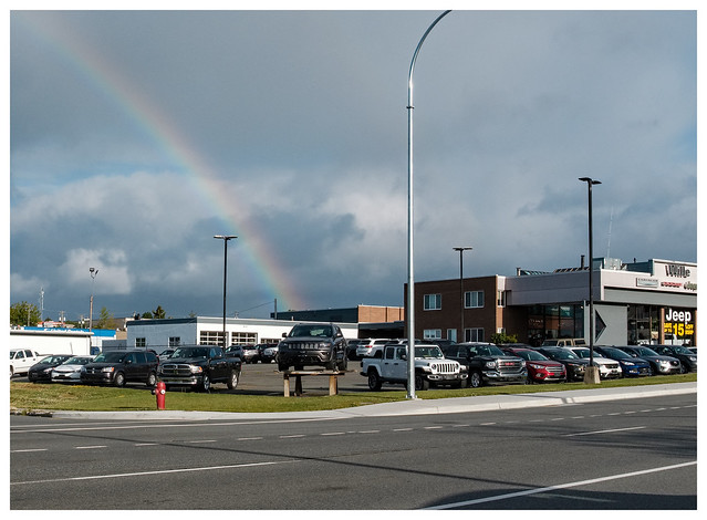 douglas street (3200 block): rainbow over new car lot