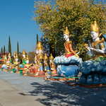 Stockton Cambodian Buddhist Temple/ Goddess of….. (# 2595) At the Stockton Cambodian Buddhist Temple (Wat Dhammararam). Per the &lt;u&gt;&lt;a href=&quot;https://s3.us-west-1.amazonaws.com/stockton-2019/images/Files/stockton_cambodian_buddhist_temple_guide.pdf&quot; rel=&quot;noreferrer nofollow&quot;&gt;guide&lt;/a&gt;&lt;/u&gt;, the first statue (the closest) represents the Goddess of Nature, the next is the Goddess of Earth, and the next is Four Faced Goddess where the faces represent Mercy, Happiness, Kindness, and Peace.  Names for the statues further in the line weren’t available. 

Use the &lt;i&gt;Cambodian Buddhist Temple&lt;/i&gt; tag to see other pictures of the temple.