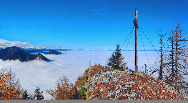 Matzen (1627 m) - View from the peak on Karawanki rising from the fog and further ranges of the Alps.