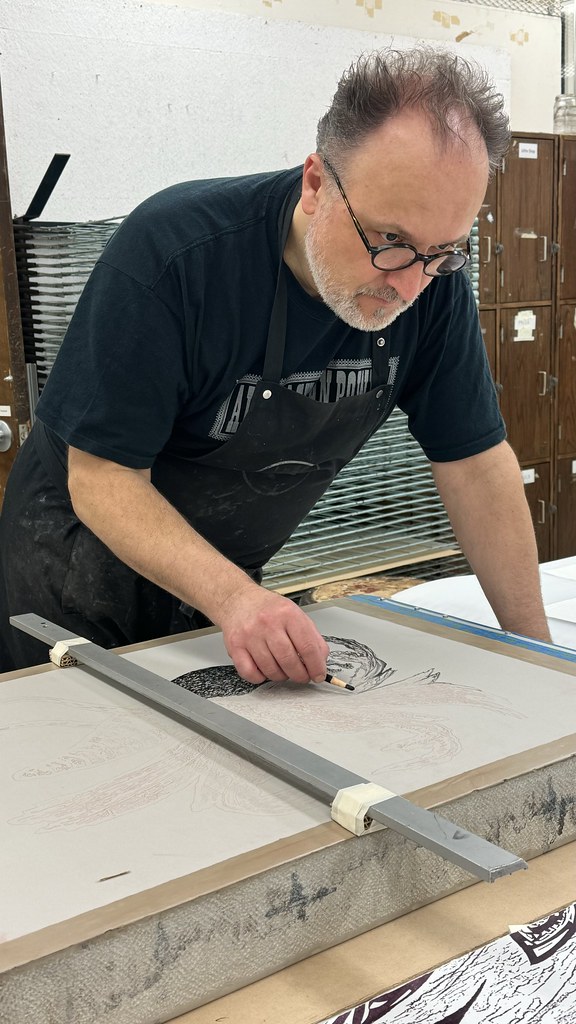 Endi Poskovic drawing on a lithography stone.
