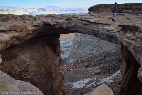 Standing on the edge of Skylight Arch, Glen Canyon National Recreation Area, Utah