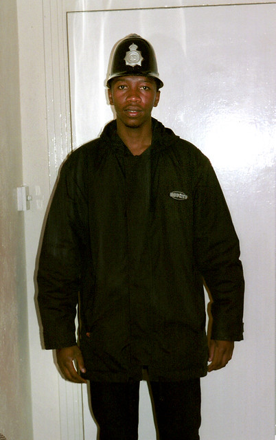 Musa South African Zulu from Soweto Township dressed as a British Bobby Policeman Photoshoot Havercourt Studio London Nov 2001 004