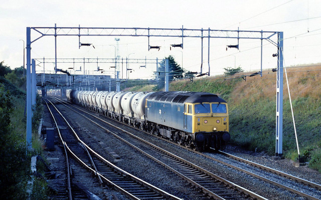 Before the arrival of Tame Valley Parkway station and at a time when class 37's were the normal traction...6M26 47113 (D1701) Earls (Hope)-Handsworth cmt Tame Valley forthcoming station site  03-08-1987