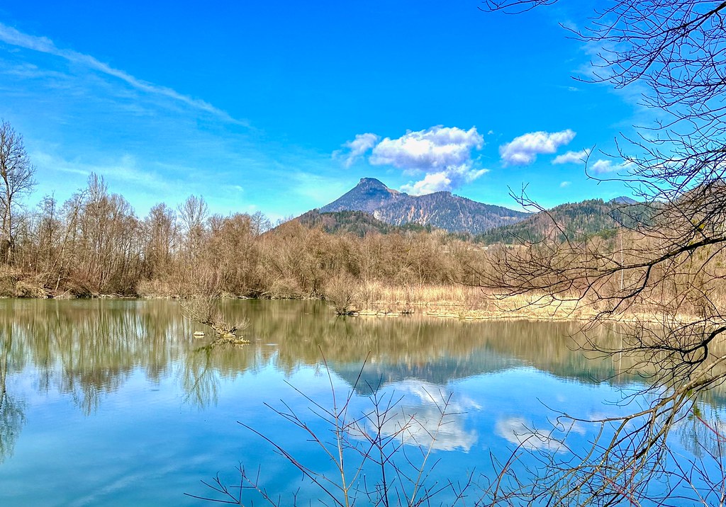 Lake Rechenauer See with reflections and Wildbarren mountain near Oberaudorf in Bavaria, Germany