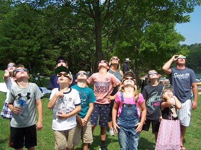 photo of kids watching a solar eclipse