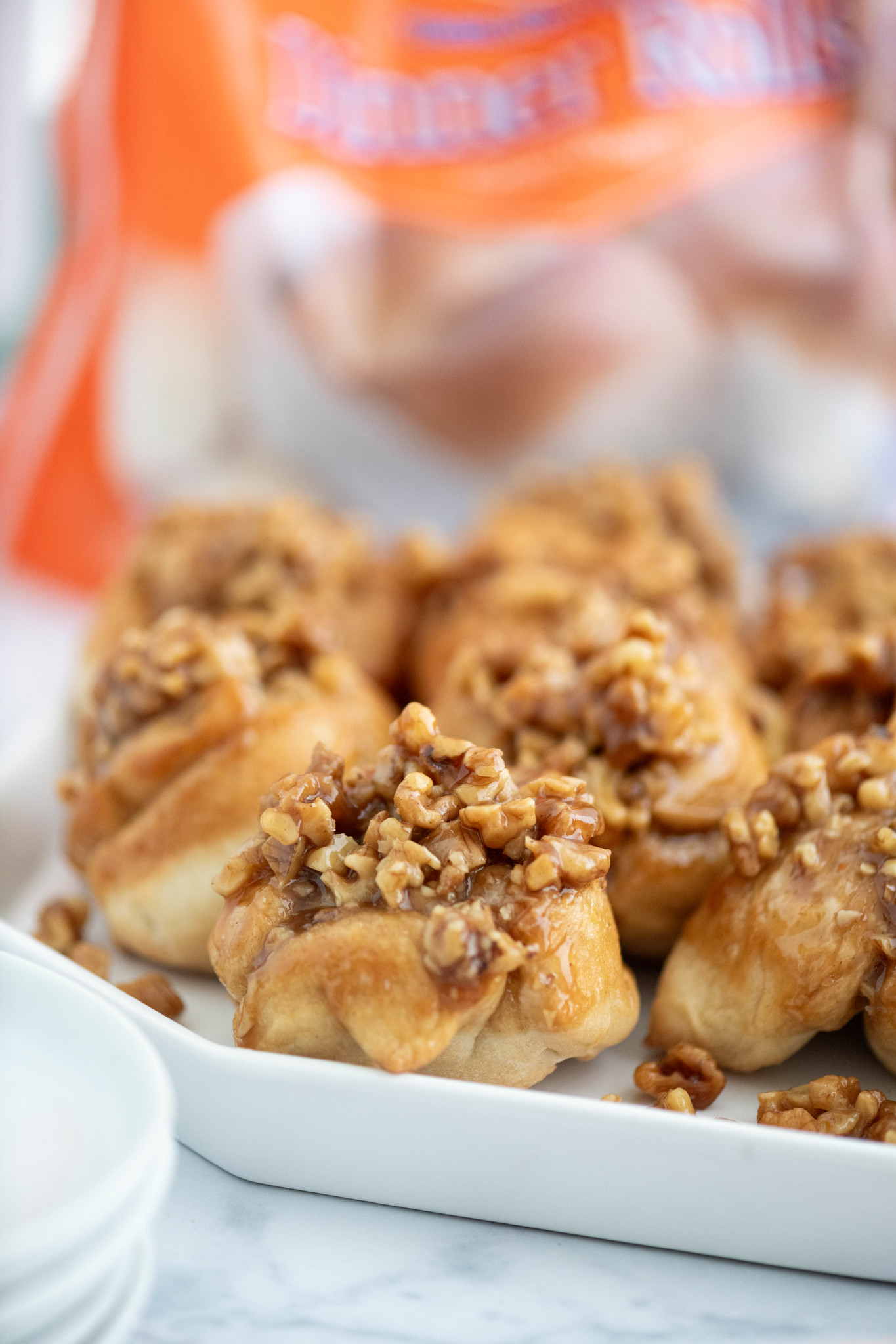 Close up of a plate of pecan sticky buns.