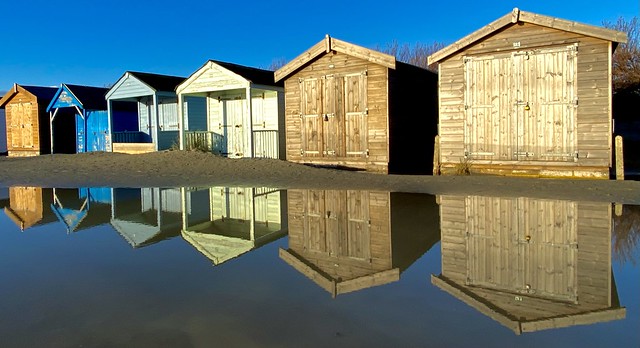 Beach hut reflections