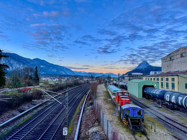 Railway yard at the old cement mill in Kiefersfelden in the river Inn valley with Pendling mountain at dawn in Bavaria, Germany
