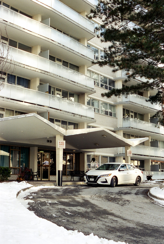 White Car and White Apartment Building