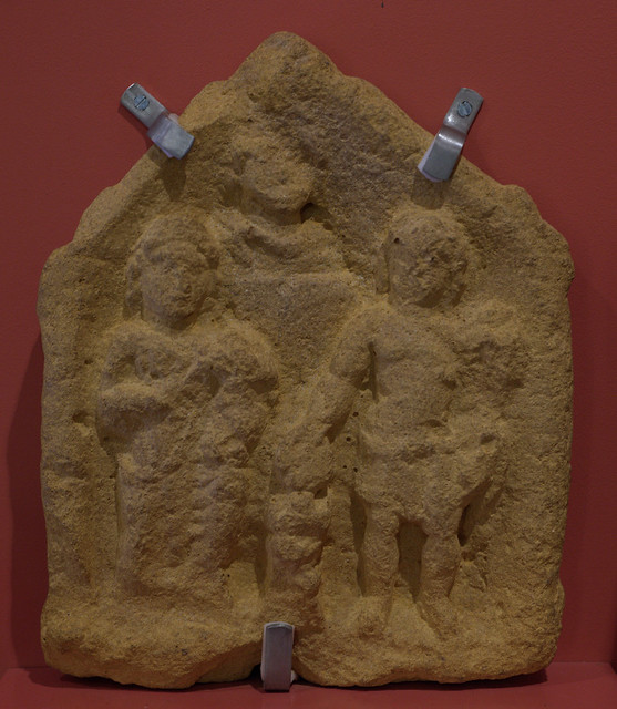 Cast of a Roman stone votive relief representing Fortuna, Bonus Eventus, and a villa-owner or Lar
