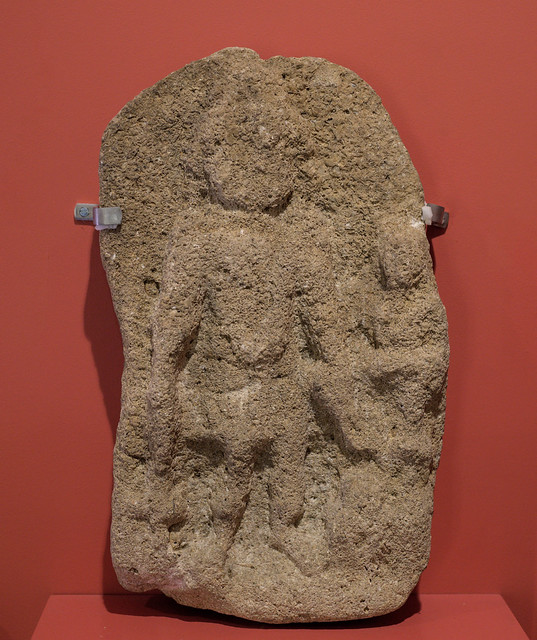 Roman stone votive relief representing the god Vulcan