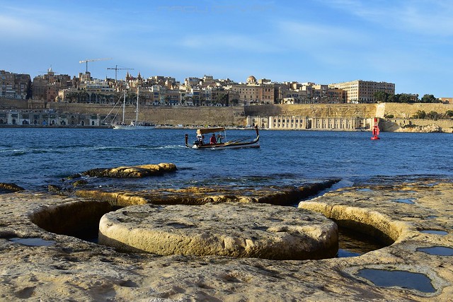 View of city from Birgu side with luzzu on Grand Harbour