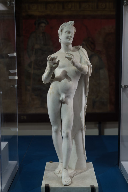 Roman marble statue representing a young satyr playing a flute, 1