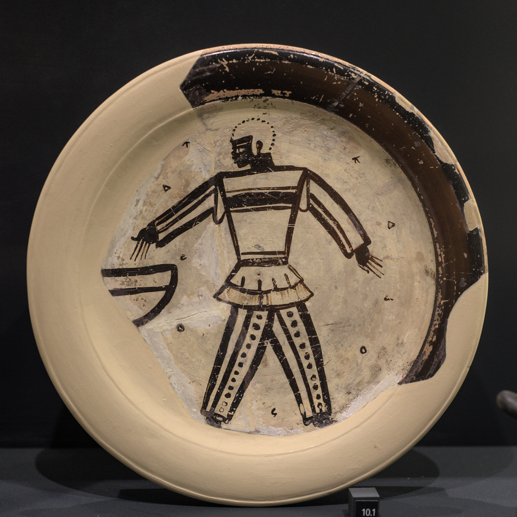 Athenian White Ground plate representing an Ethiopian warrior beside a louterion