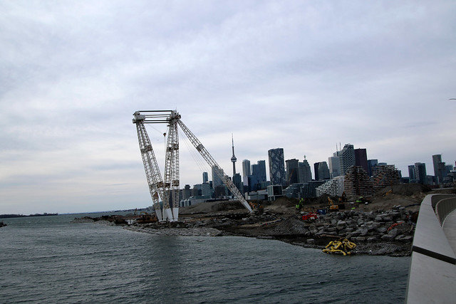 Toronto Skyline + Don Mouth Naturalization/Port Lands Flood Protection: Looking Notth-West From The New Cherry St South Bridge At The New Mouth Of The Don River And Park Still Being Built + Terminal 35 Altals (1954) Crane