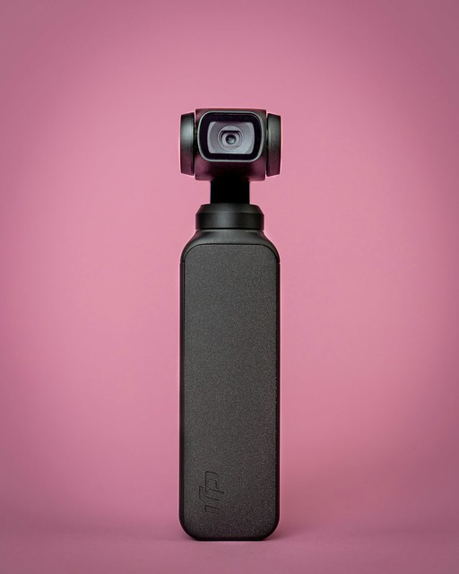 DJI Osmo Pocket handheld gimbal camera with pink background
