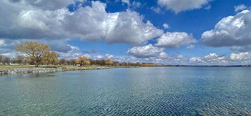 March 28, 2023: Seneca Lake shoreline from Lakefront Park, Geneva, New York Looking eastward along the northern shore of Seneca Lake from Lakefront Park in Geneva, New York on a beautiful early spring day.