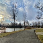 March 19, 2023: Late-winter evening sunshine at Ellicott Creek Park, Tonawanda, New York The evening sun hangs low in the sky over Ellicott Creek Park in Tonawanda, New York on a chilly but pleasant day in early spring.