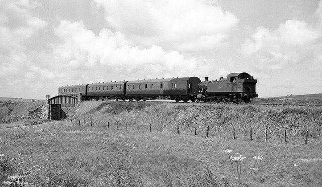 St Blazey's BR/WR 2-6-2 No 5531 heads a three coach local from Newquay to Par on Goss Moor, Cornwall.