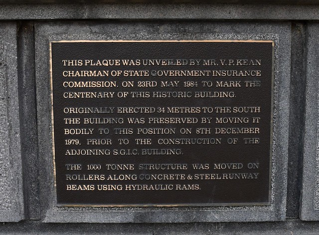 Commemorative plaque on the front of the former Harbors Board building: erected 1884 for National Australian Life Assurance. Facade and building to the depth of a room shifted 34 metres to this position 1979. Adelaide South Australia
