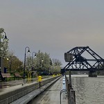April 28, 2023: A rainy spring day on the Erie Canal, North Tonawanda, New York As trees blossom beautifully, a spring rain falls over Gateway Park in North Tonawanda, New York, at the western end of the historic Erie Canal.
