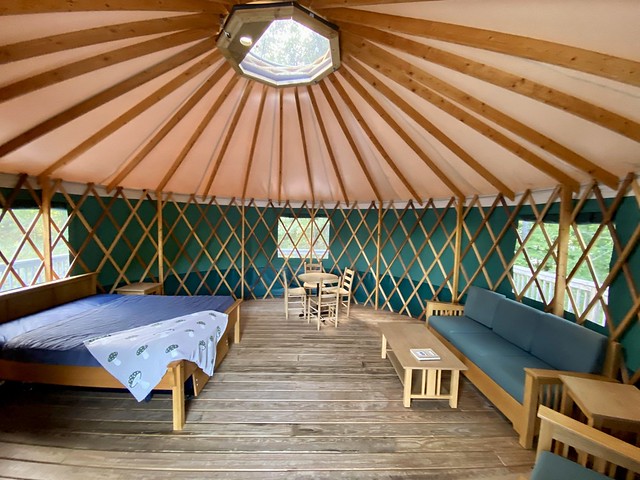 A look inside Machicomoco State Park’s yurt #1, with blankets brought from home on the bed. Photo by Haley Rodgers. 