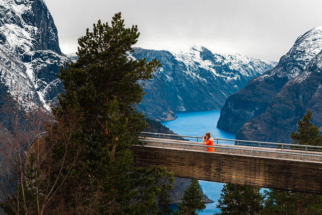 Aurlandsfjord, Stegastein viewpoint and a photographer in a nicely contrasting jacket.