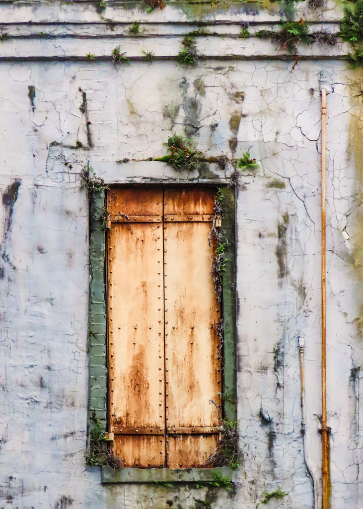 Old rusted metal storm shutters / Savannah Georgia