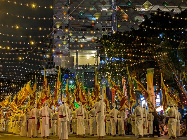Men with Flags - February Full Moon (Poya) Festival - Colombo. Sri Lanka