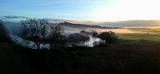 A misty river sunrise
