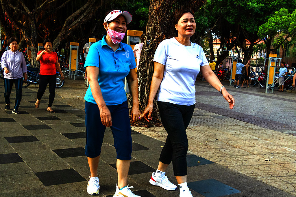 Two women holding hands lightly on 3-20-24--Vung Tau copy