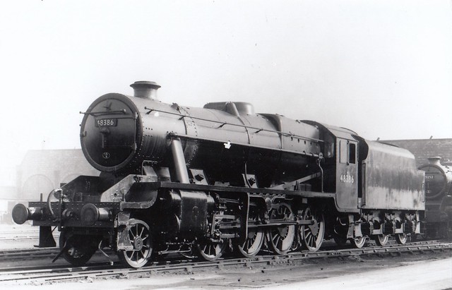 Stanier Class 8F 2-8-0 48386 outside Crewe works with Black Five 45252, 26th February 1950.