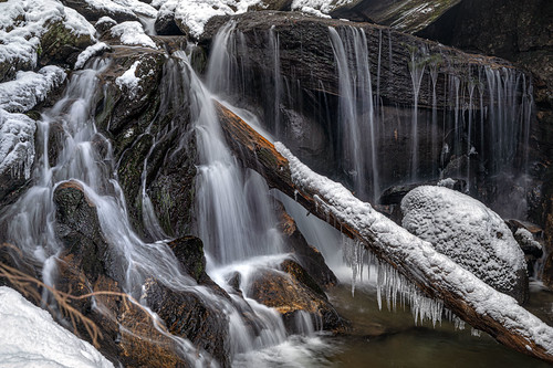 In the Grips of Winter by Simmie | Reagor - https://www.simmulated.com/blog, That fallen tree has been wedged in the falls for many seasons now.  Rain, snow, heat and humidity a