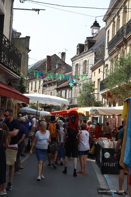 Umbrellas down the busy market street - Le Bugue Dordogne Nouvelle-Aquitaine France