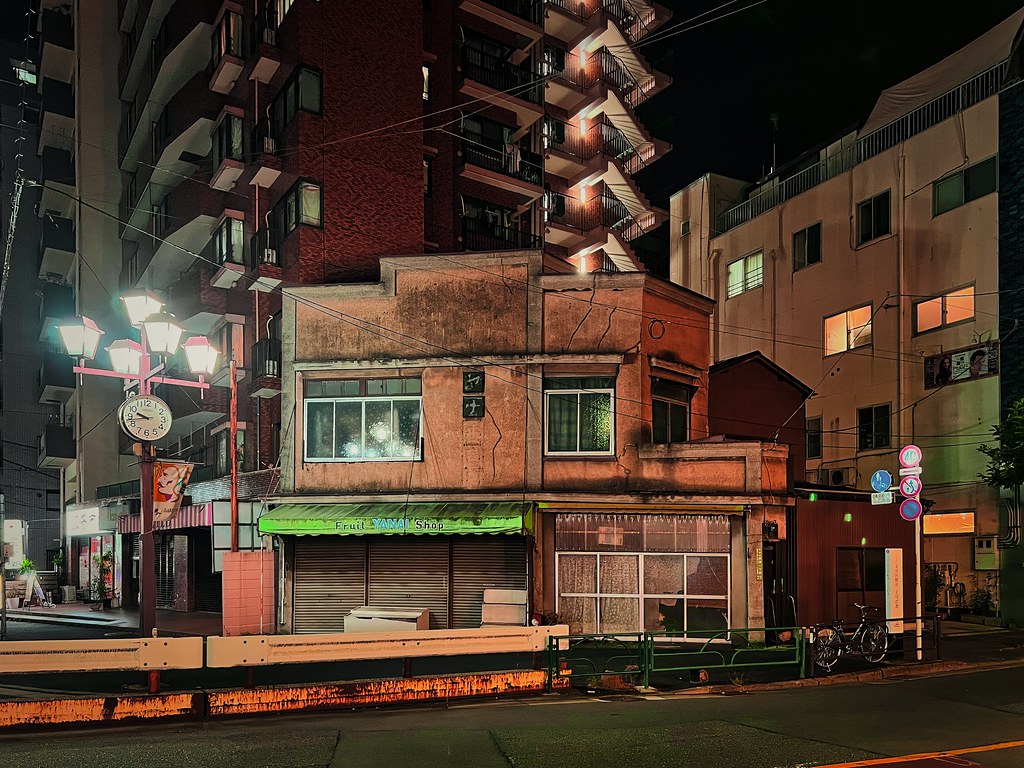 Aging Storefront Under Tokyo Lights