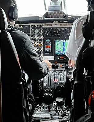 Pilots and instrument panel in cockpit