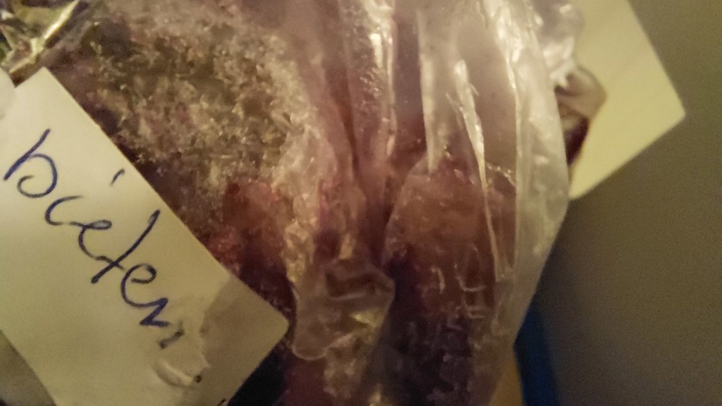 Bag with red beetroots in the freezer