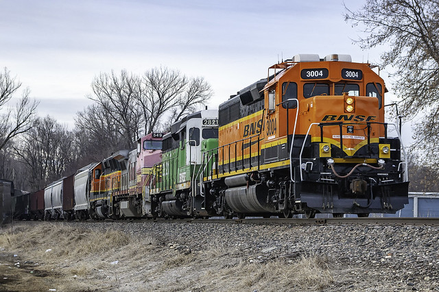 A colorful bunch, BNSF 3004 leads the rainbow consist of the eastbound Bayard Local on the Bayard Sub at Council Bluffs IA 3-4-12 © Paul Rome