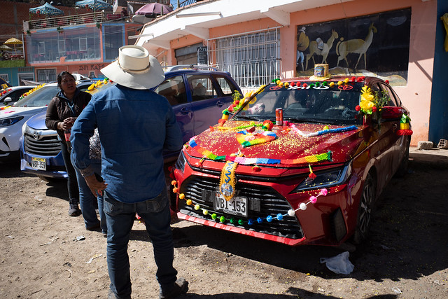 Decorated vehicles and their owners at the Virgin of Candelaria Festival, Copacabana, Bolivia.