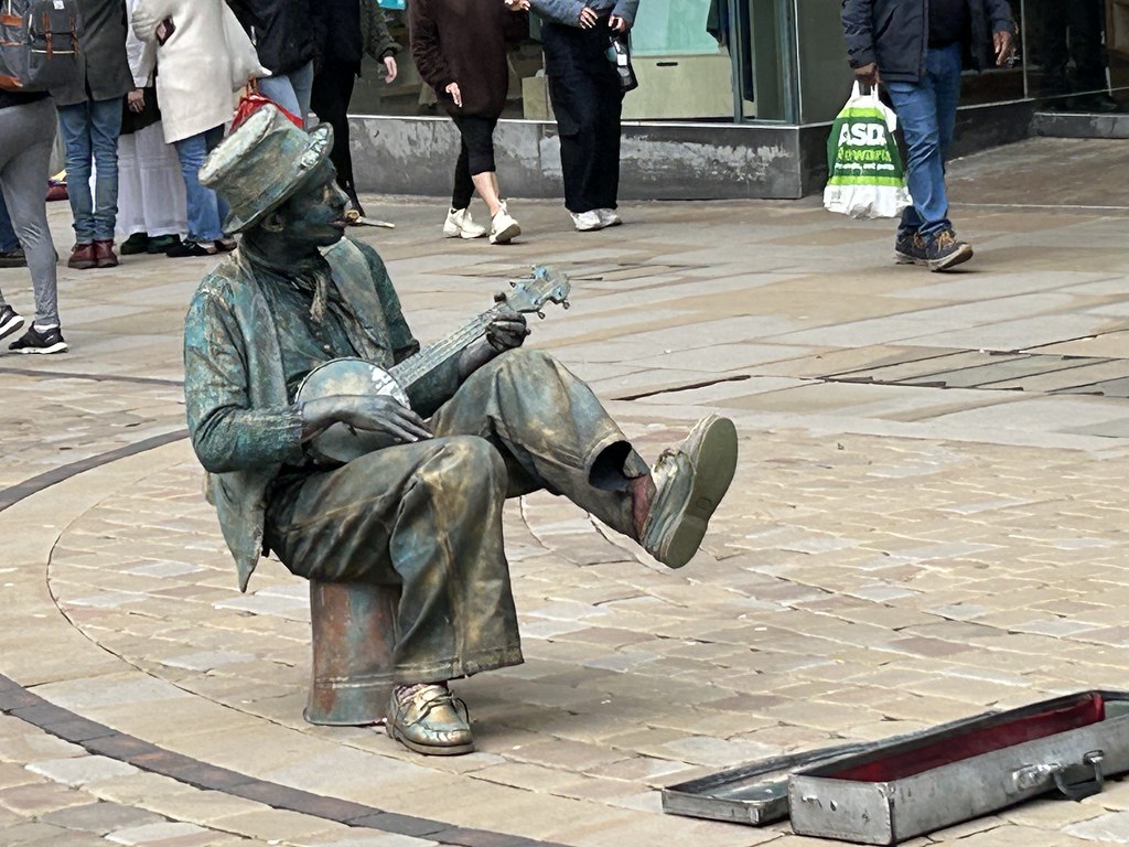 Street Performer, Manchester playing a kazoo !!!