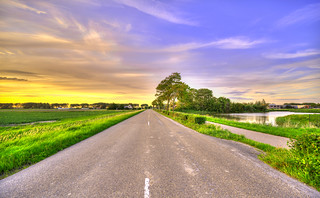 Cut at the cutting line. Kanaalweg, village of Warmenhuizen, The Netherlands.