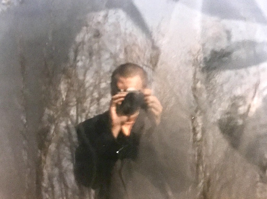 Selfie in broken glass at the end of the 1990 before professional selfie machines like digital cameras and smartphones was readily available on the common market ( A young me in Denmark, the cottage village clearing out the backyard )