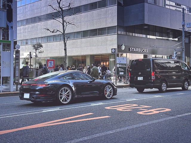 Black Porsche on Shinjuku's Streets