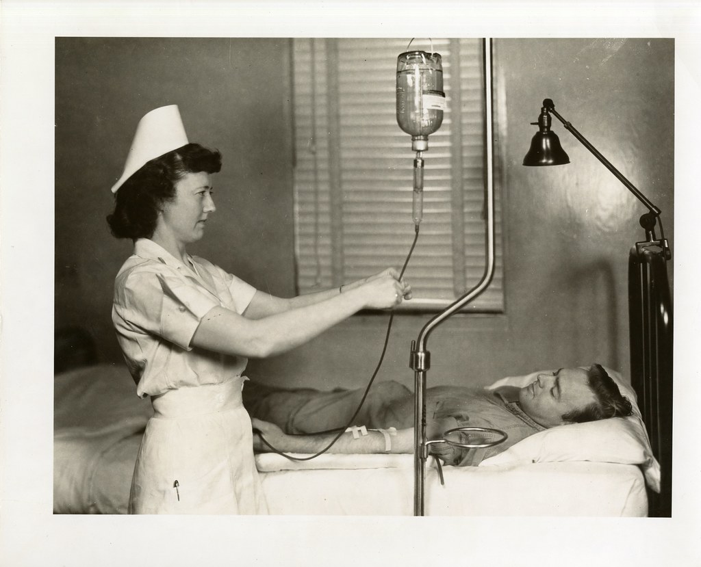 Injections: Nurse Checking Patients I.V. Bottle at Bolling Air Force Base, Washington, D.C.